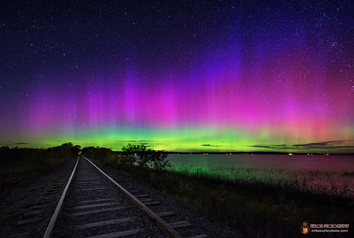 The auroa borealis. The stranded colors of de-exciting atoms show the tenuous magnetic field lines of the upper atmosphere.